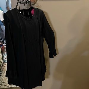 Adorable black long sleeve shirt with ruffle on end of sleeve
